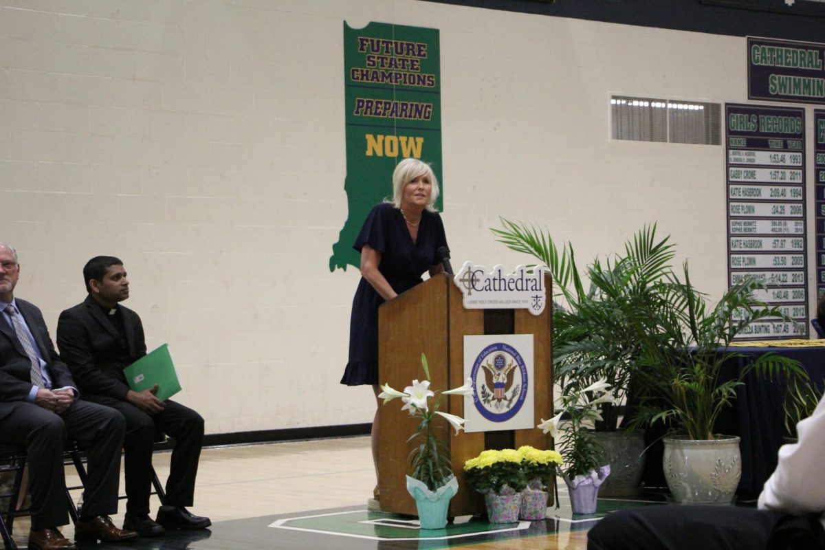 Principal Julie Barthel welcomes the attendees to the National Honors Society Induction Ceremony. This ceremony celebrates the current seniors while also welcoming the juniors to NHS.