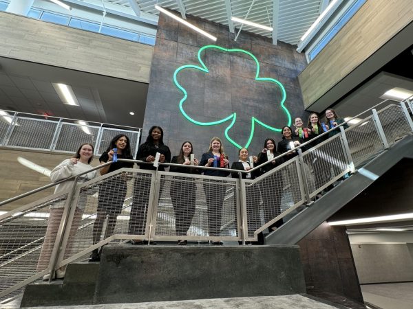 Speech and debate team poses after the awards ceremony with their ribbons. Left to right: senior Olivia Uskert (captain), sophomore Micaela Ward, sophomore McKenzie Jordan, junior Beatrice Murray, senior Sophia Beeson (captain), junior Andrea Aluaiza, freshman Mia Morris, freshman Andrea James, freshman Delaney Brogan, freshman Olive Schomacker, and senior Emily Pohl (captain).