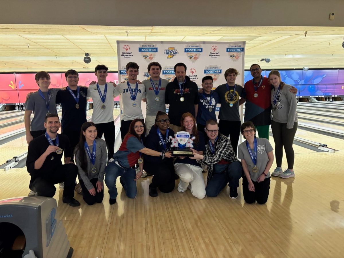 The Champions Together bowling team poses with their state championship. The team took home first place with a coed score of 757, which is the unified bowling state record. 