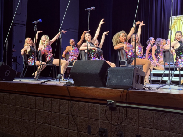Members of Cathedral High School’s Irish Adrenaline perform high-energy chair choreography during show choir preview night on January 30th. The performance was part of their competitive set “BraveHearts,” which highlights strong and influential women while showcasing sharp choreography and stage presence. “This number is one of my favorites because it really lets us show our confidence and connection as a team,” said Isabella Cadewell ‘26 a dancer in Irish Adrenaline.