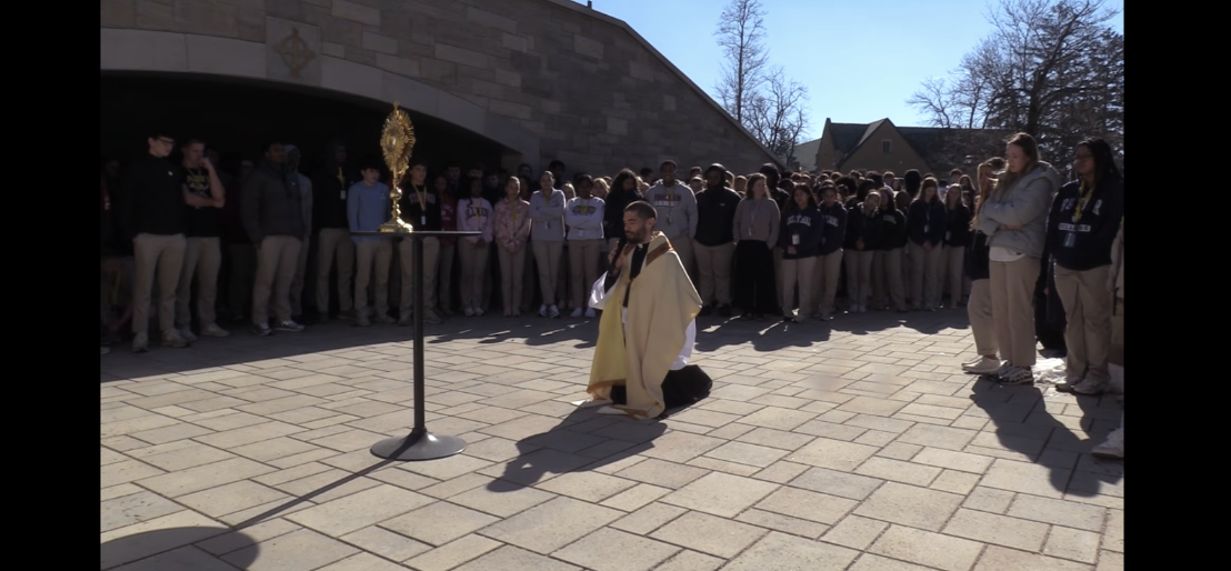 The Cathedral community gathers around the Eucharist as Fr. Geoff kneels to pray. The entire student body was guided by the Eucharist in prayer, ending in the Grotto. Howell said, “We are a Catholic school that is rooted in the Holy Cross tradition. And we are guided by those principles that we believe are closest to the capital T - truth. We are led by the example of Christ as teacher, as leader.” 