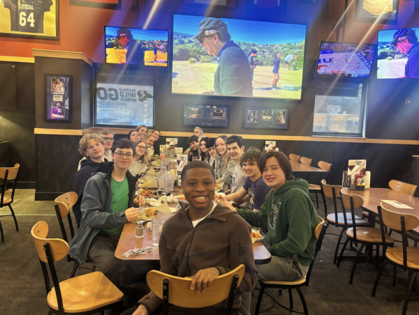 The Cathedral swim team sits together at Buffalo Wild Wings after the boys sectional meet to celebrate a great season. The team gathered to reflect on the season, which marked the final
high school meet for seniors. “Being part of this team has shown me what it means to work hard for something bigger than yourself,” freshman Grant Reid said.