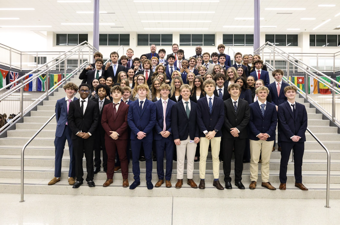 Cathedral DECA Students line up along the steps at Brownsburg High School. 51 students qualified for state, advancing to the next stage. 
Jack Wright '28 said, “I was not surprised when I advanced to the next stage for DECA. I’m just very excited to be able to attend state.”
