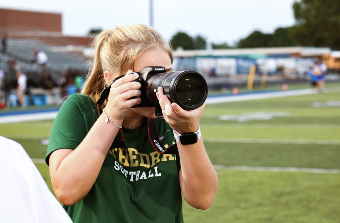 Payten takes pictures during a football scrimmage at Franklin Central High School. This experience marked the second time Elliott had taken photos for a game. Elliott said, “I’m thankful for the opportunity to participate in these activities.”
Photo by Lacey Nix.