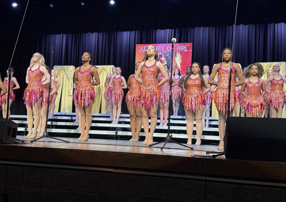 Cathedral’s Irish Adrenaline performs its competition set BraveHearts during the Plainfield show choir competition on February 14. The girls' facial expressions become serious as they stand strong and tall. The group earned Grand Champion along with Best Vocals and Best Visuals. 
