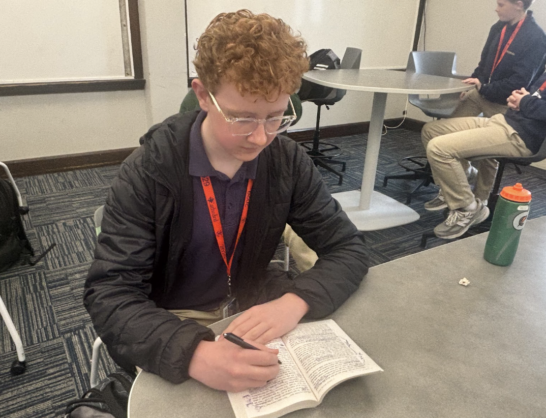 Jonathan King annotates his English 9X reading prior to the class lecture. King currently holds the Cathedral Scholarship and is President and Founder of the new Success Club. King said, “I appreciate the opportunity to have more time to go deeper into class, have more discussions and dive into the content more thoroughly.” 